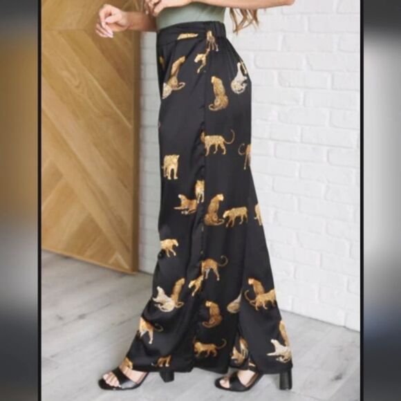 Stylish black wide-leg pants. Features a bold leopard print. - Picture 10 of 15